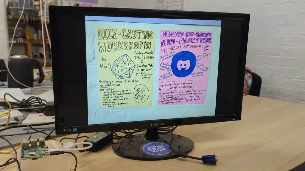 picture of TV screen, showing some pictures of posters